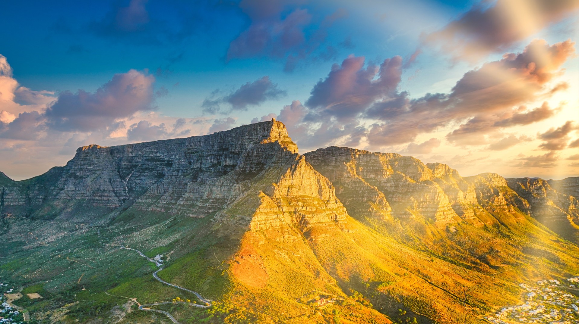 Table Mountain stands as a beautiful unique backdrop for Cape Town and is a must-see when spending two weeks in South Africa. Visiting Table Mountain during the golden hour when spending two weeks in South Africa.