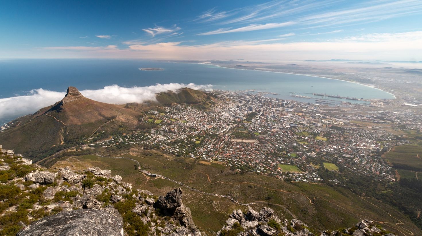 A panoramic view of Cape Town with Lions Head and Robben Island.