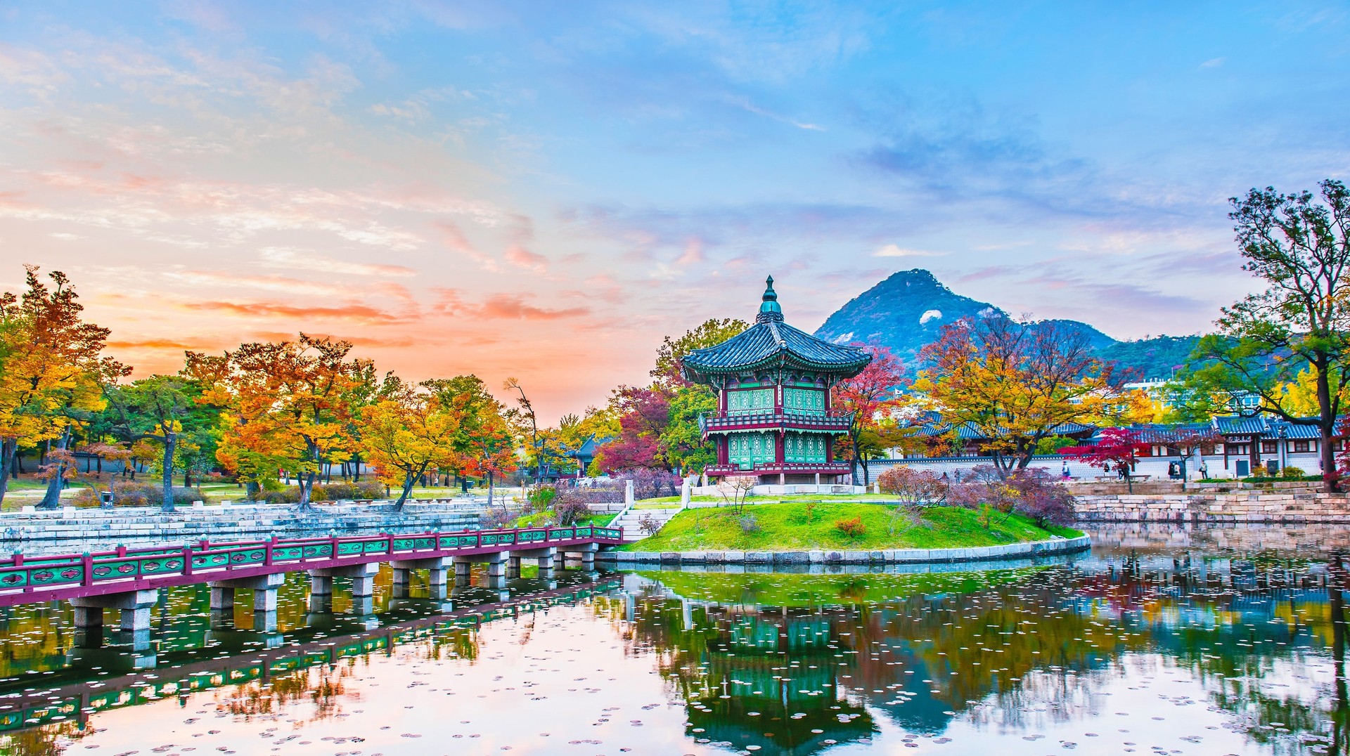 South Korea looks like a place out of a fairytale when it is covered in fall colors in September. View the Gyeongbokgung Palace during fall in South Korea in September.