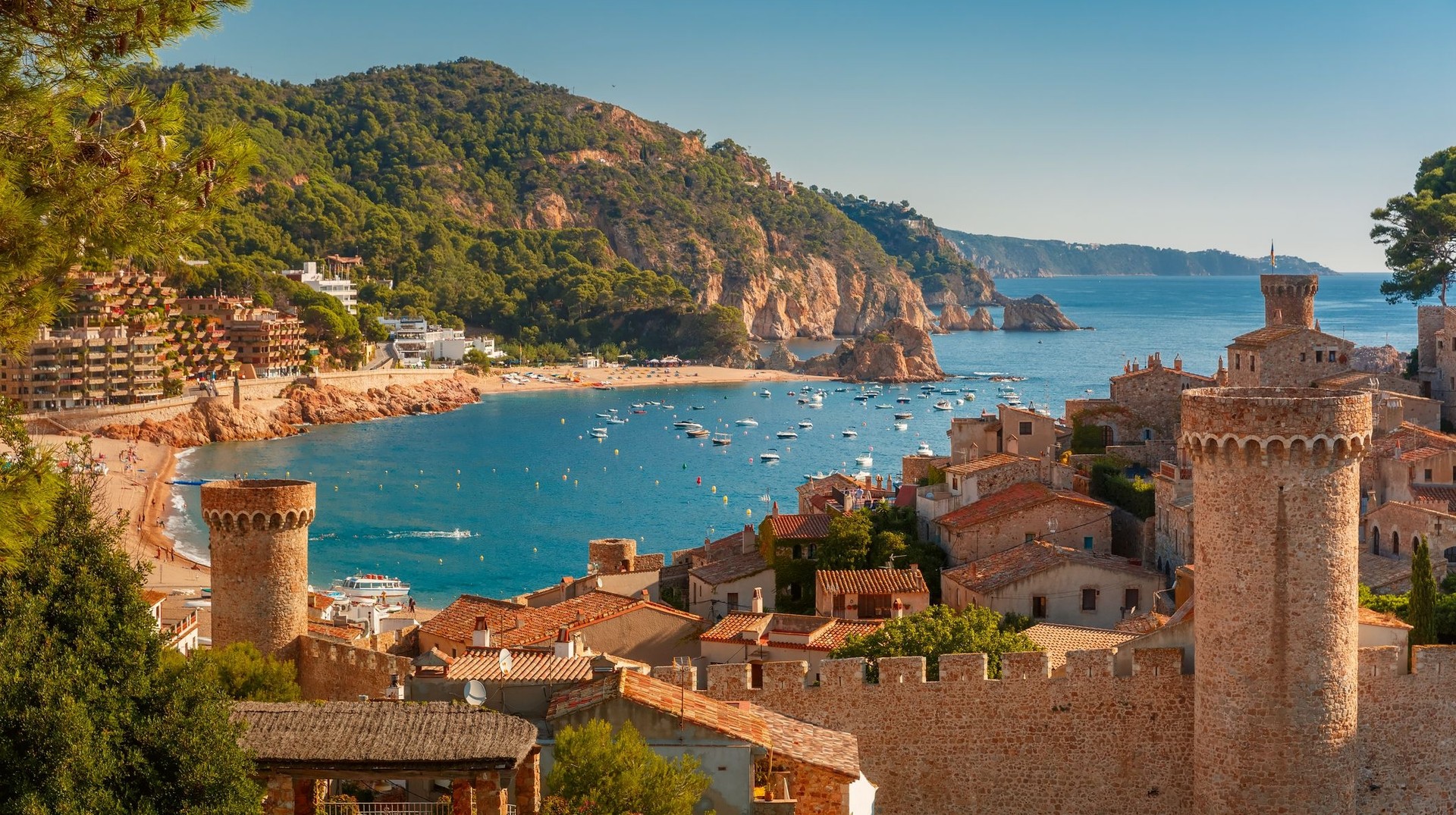 When spending 14 days in Spain be sure to explore the Fortress Vila Vella and Badia de Tossa bay in Costa Brava. The beach town in Costa Brava, a must visit when spending 14 days in Spain.
