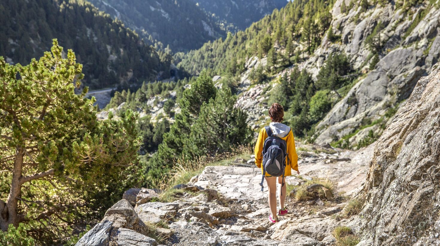 Girl hiking in Pyrenees' mountains. Girona, Spain