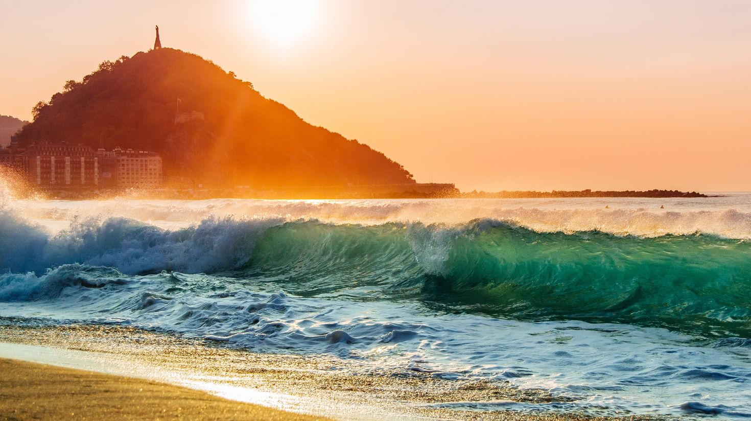 A nice shorebreak during sunset at the Zurriola beach of San Sebastian.