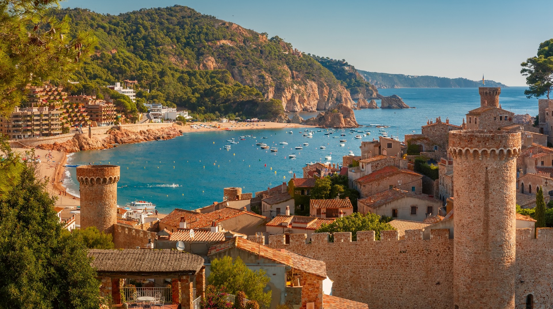 Spain is known for its arts and culture, scrumptious food, marvelous architecture, museums, and impressive shopping options. Aerial view of Fortress Vila Vella and Badia de Tossa in January