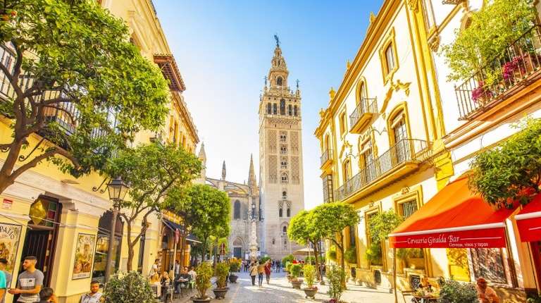 Panoramic city view with Seville Cathedral and Giralda tower in Spain