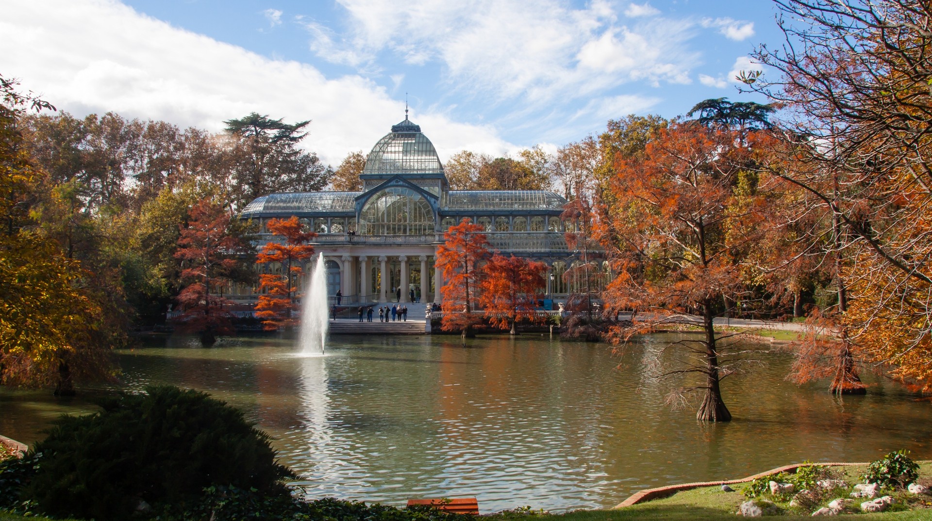 Autumn foliage provides a striking display of color in Palcio de Cristal of the Retiro Park, Spain. Palcio de Cristal of the Retiro Park. Madrid