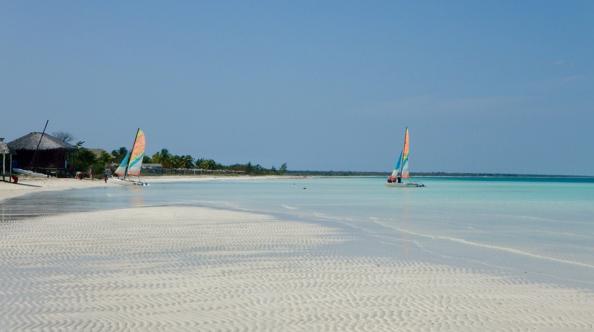 Boats in the shallow waters of Cayo Coco during summer in Cuba.