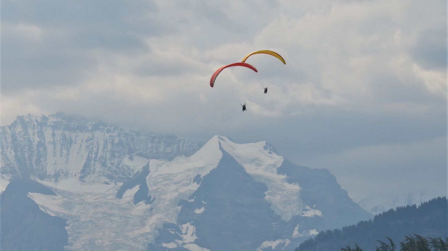 Enjoy paragliding in Interlaken in June.