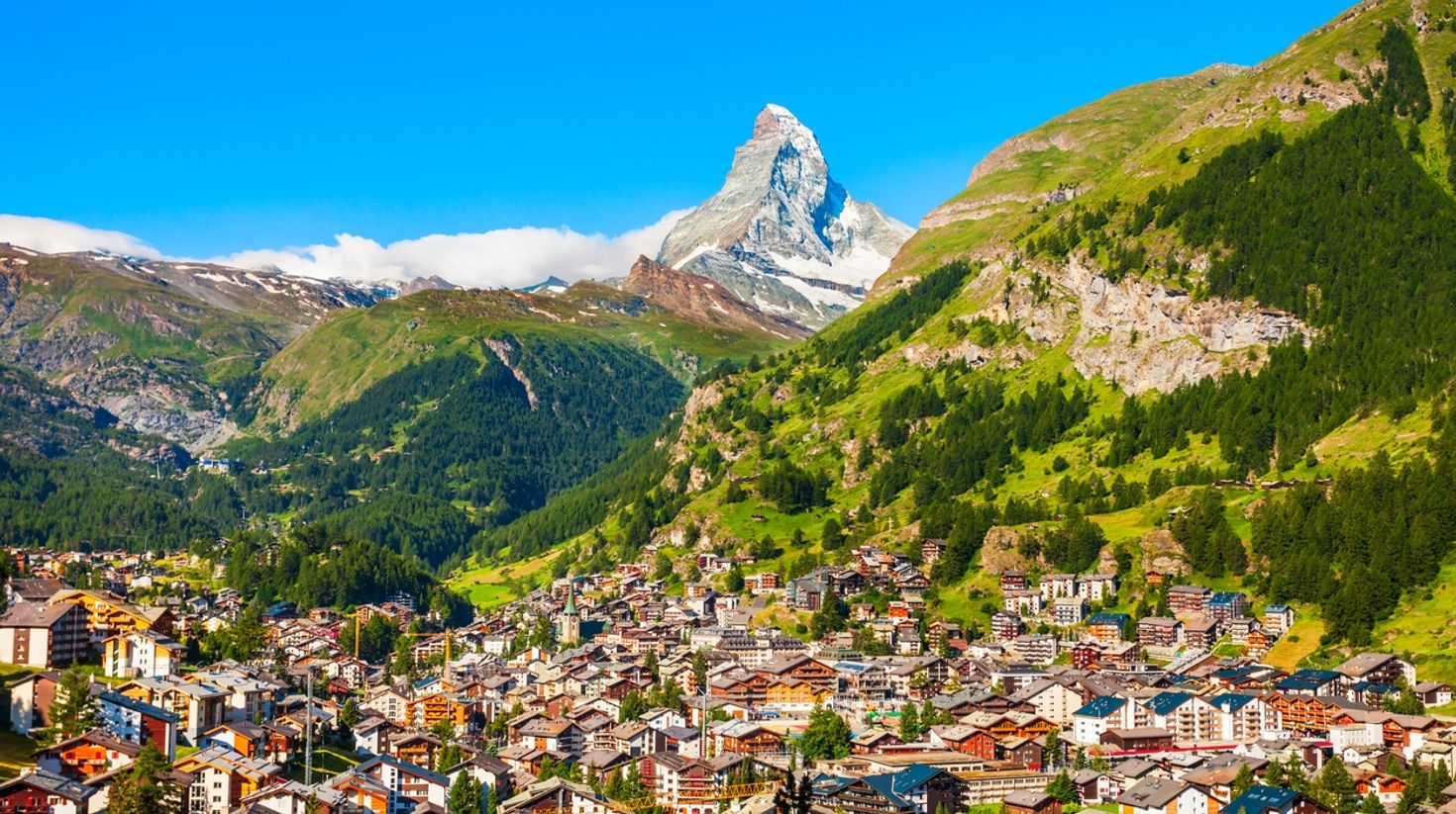 The traditional houses in Zermatt are amazing Swiss vacation spots.
