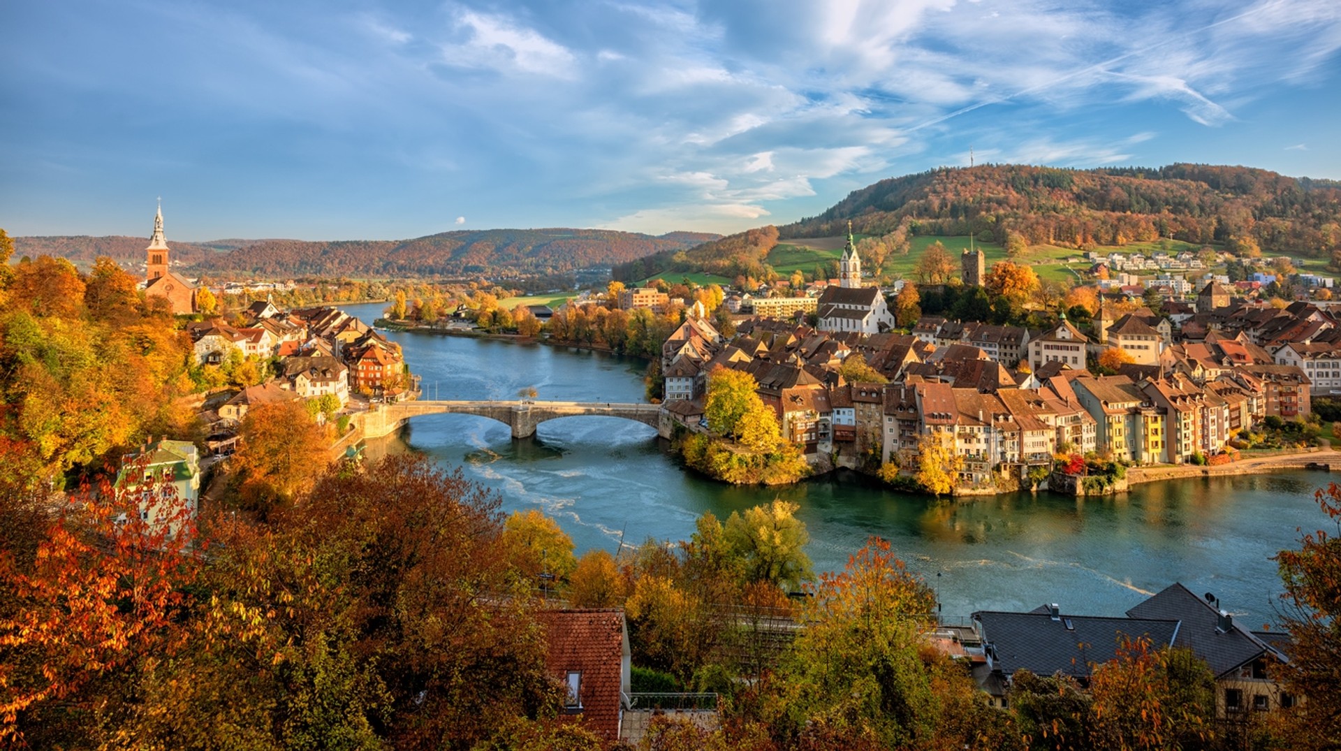 Switzerland is popular for its snowy slopes but watching the country covered in fall colors in October is magical. Watch the trees turn into fall colors in Switzerland in October.