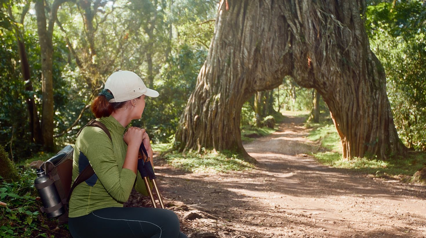 A woman taking a break while on her hike to Arusha National Park.
