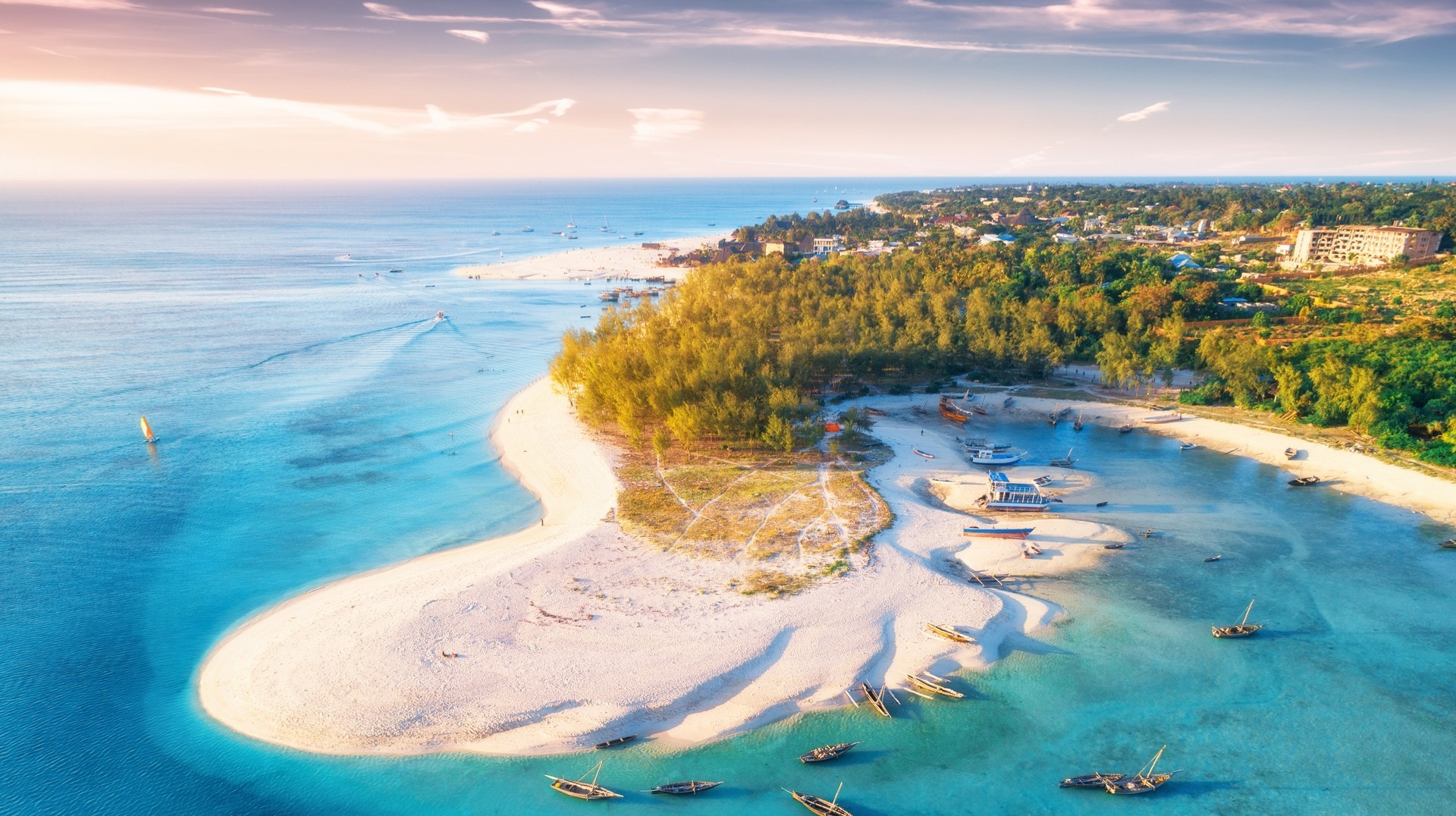 Explore the beauty of Zanzibar Island while visiting Tanzania in May. Aerial view of Zanzibar island with boats and yachts in Tanzania in May.