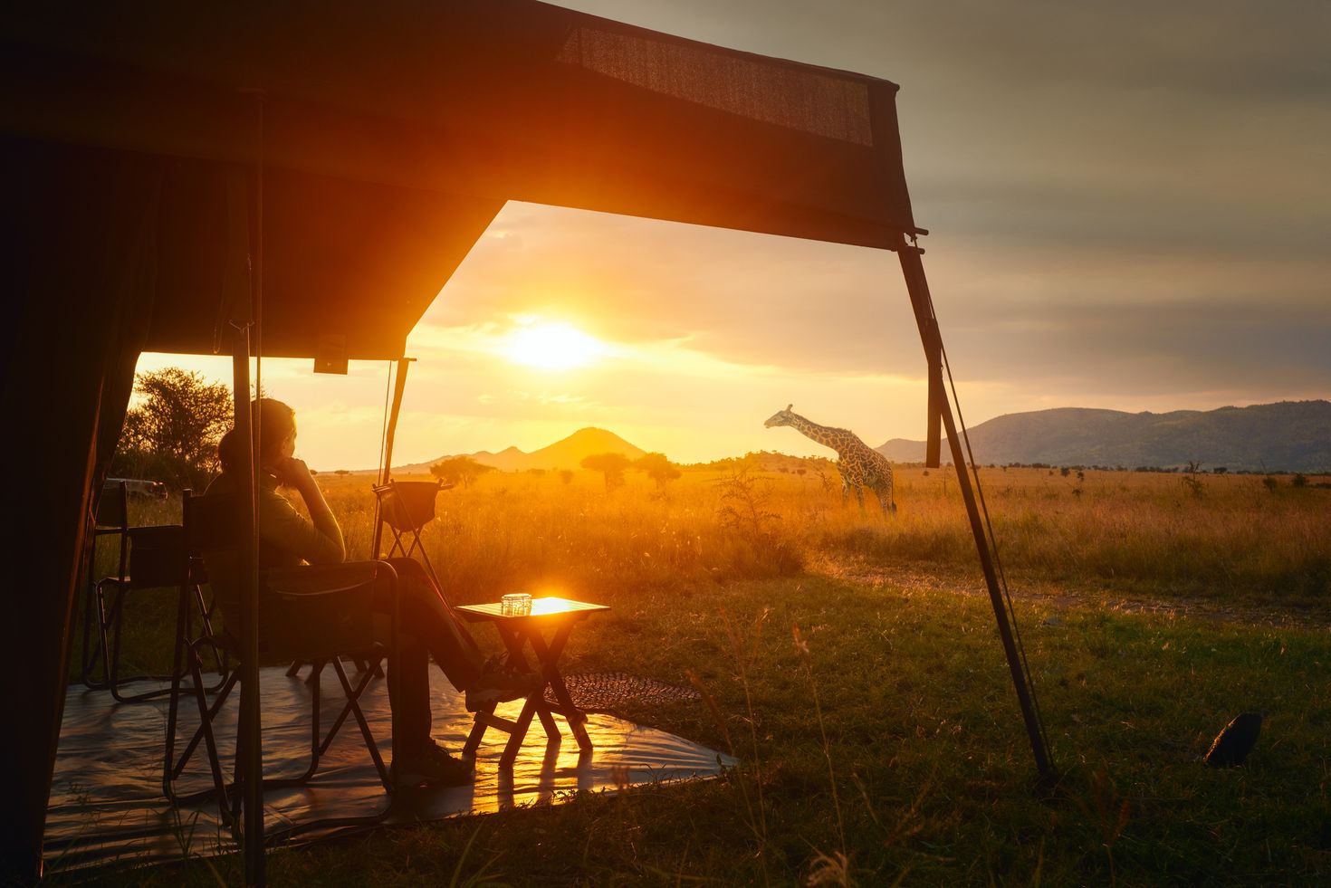 Woman rest in a luxury tent in her safari tour in Serengeti National Park