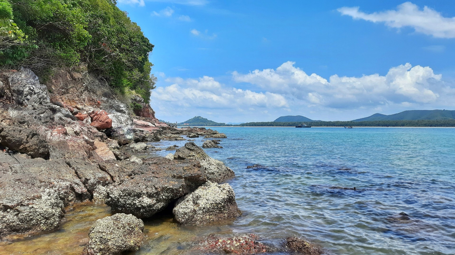 Travel to Gulf of Thailand's eastern coast, where the weather is generally sunnier and the beaches are immaculate in Thailand during July. Sea views from the Gulf of Thailand with beautiful rocks in Thailand in July.