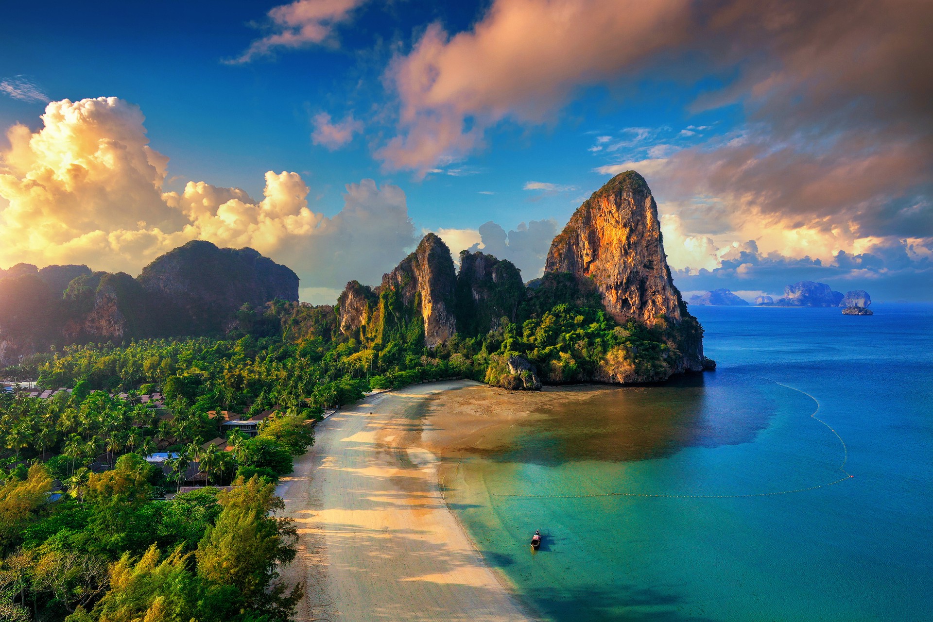 The pristine beach of Railay is only accessible through boats because of its high limestone cliffs in Krabi in Thailand during March. Aerial view of Railay Beach in Krabi in Thailand in March.