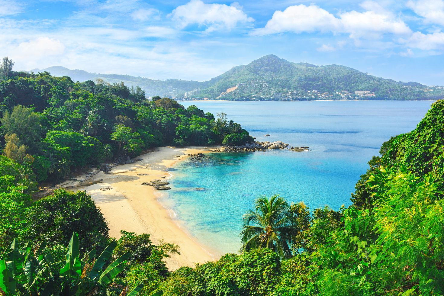 View through the jungle to uninhabited beach in Laem Sing Beach, Thailand