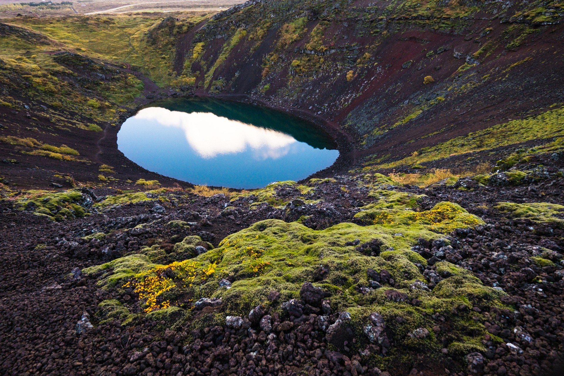 The deep opaque blue waters of Kerid is famous in its own right, but sometimes concerts are held at the crater due to its unique shape The Kerid Crater is one of the popular tourist spots in Iceland