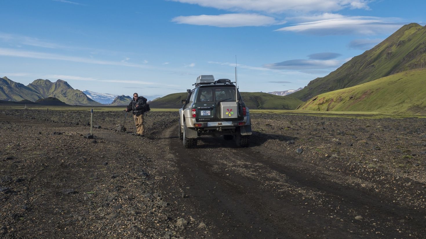 A hiker and a 4&times;4 jeep at the Laugavegur trail.