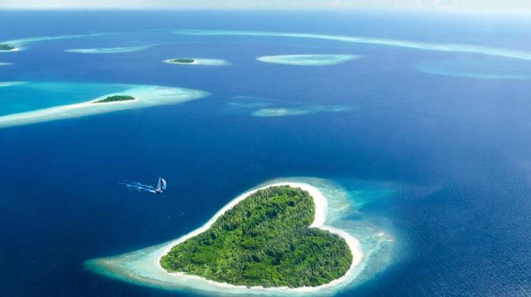 A sail boat approaching Hembadho, Maldives, in February.
