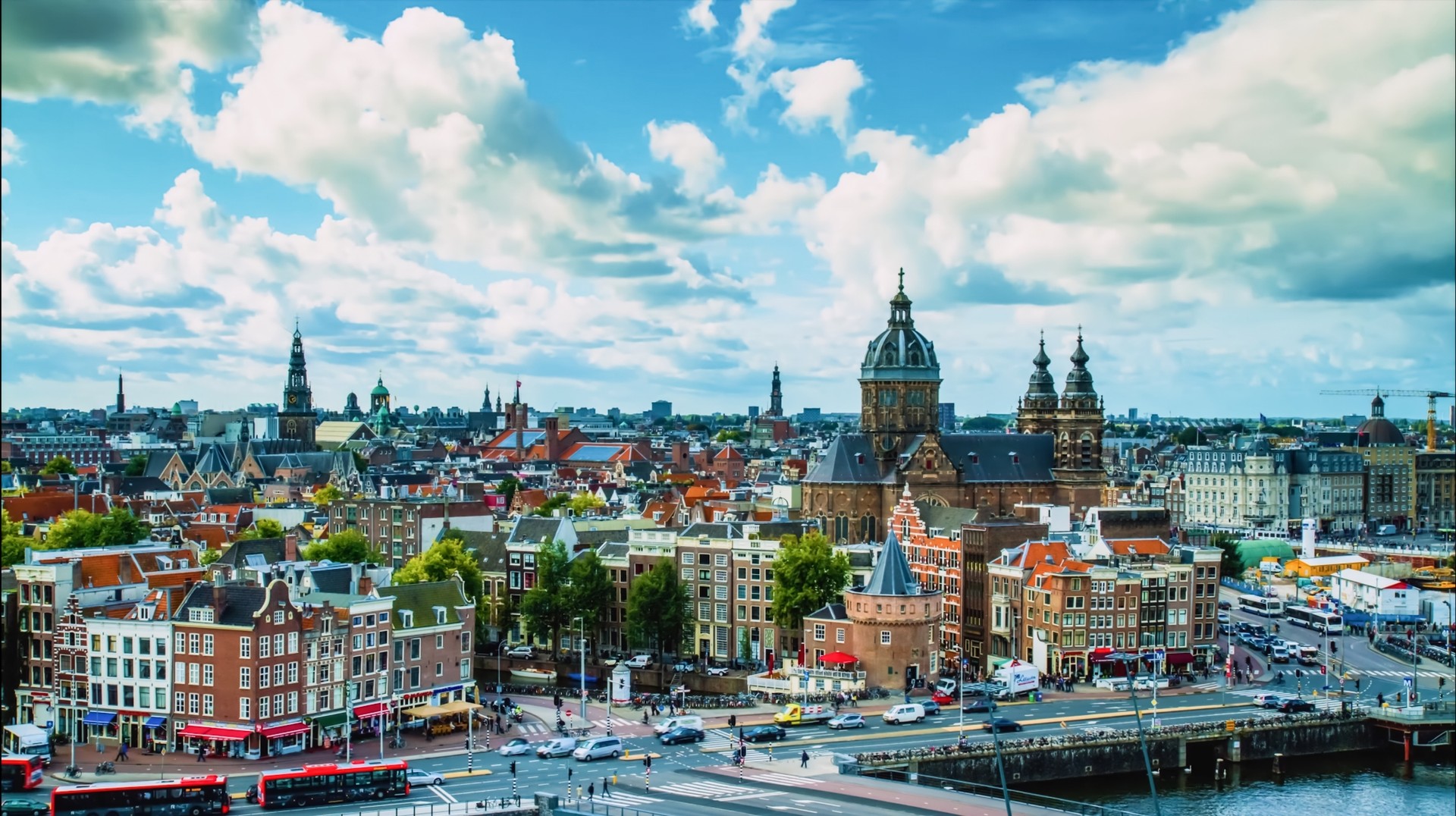 The warm and long summer days in June are wonderful for sightseeing tours in the Netherlands. A view of a city with traditional buildings in the Netherlands in June.