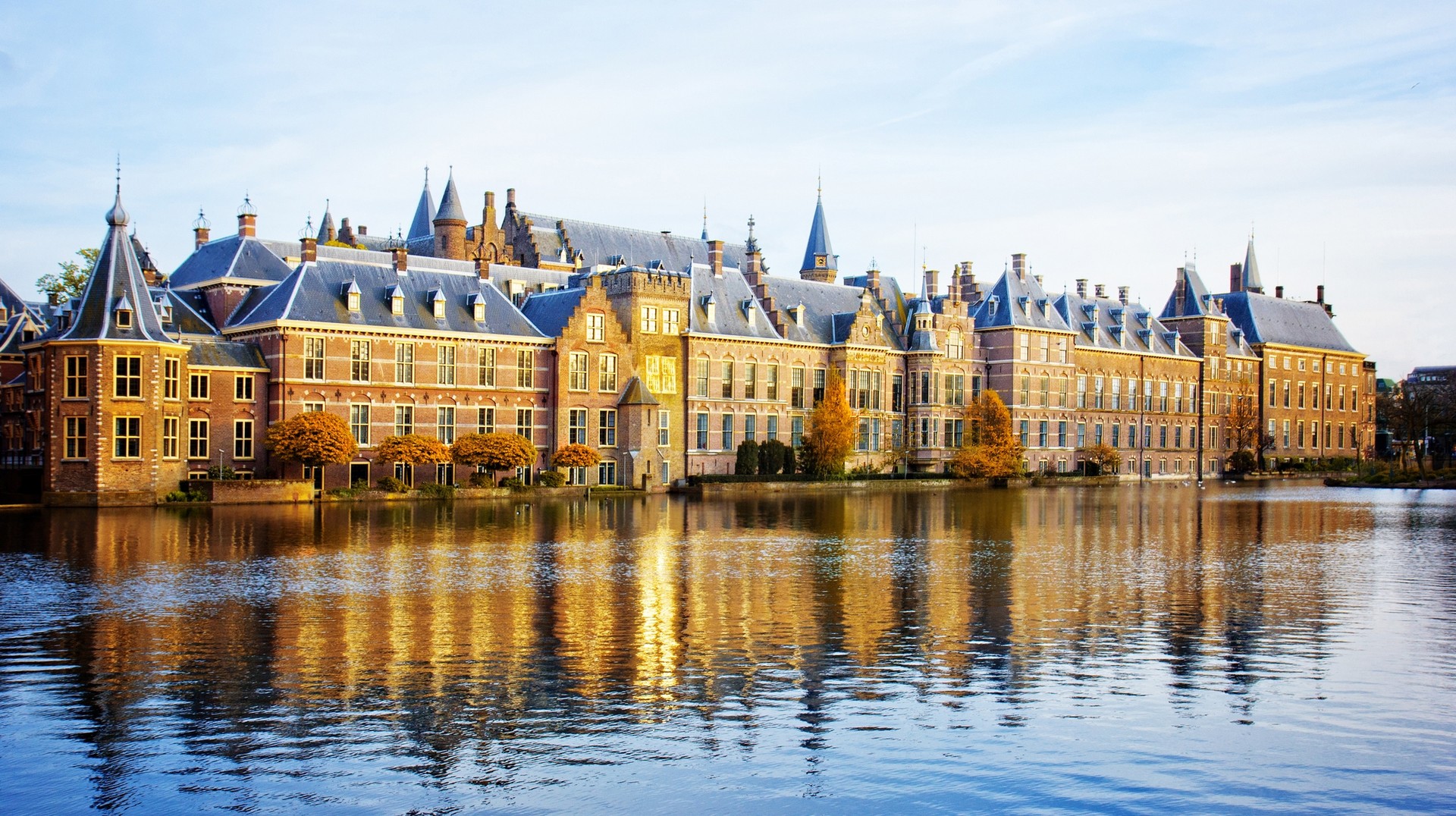 Enjoy sightseeing in the Netherlands with fewer crowds and also at good deals. The view the Dutch Parliament on a fall day in the Netherlands in November.