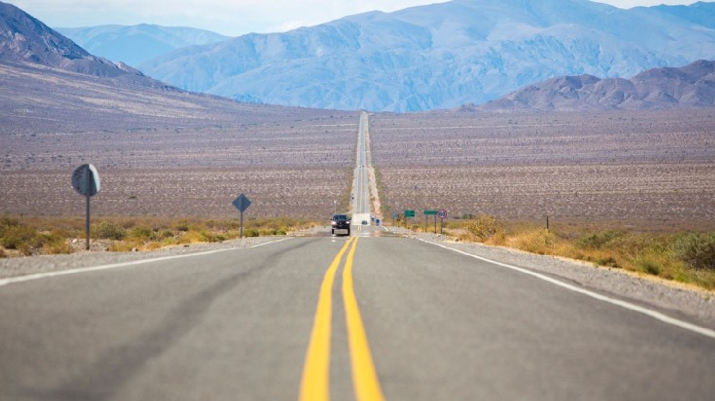 Famous Route 40 with car with scenic landscapes in Argentina.