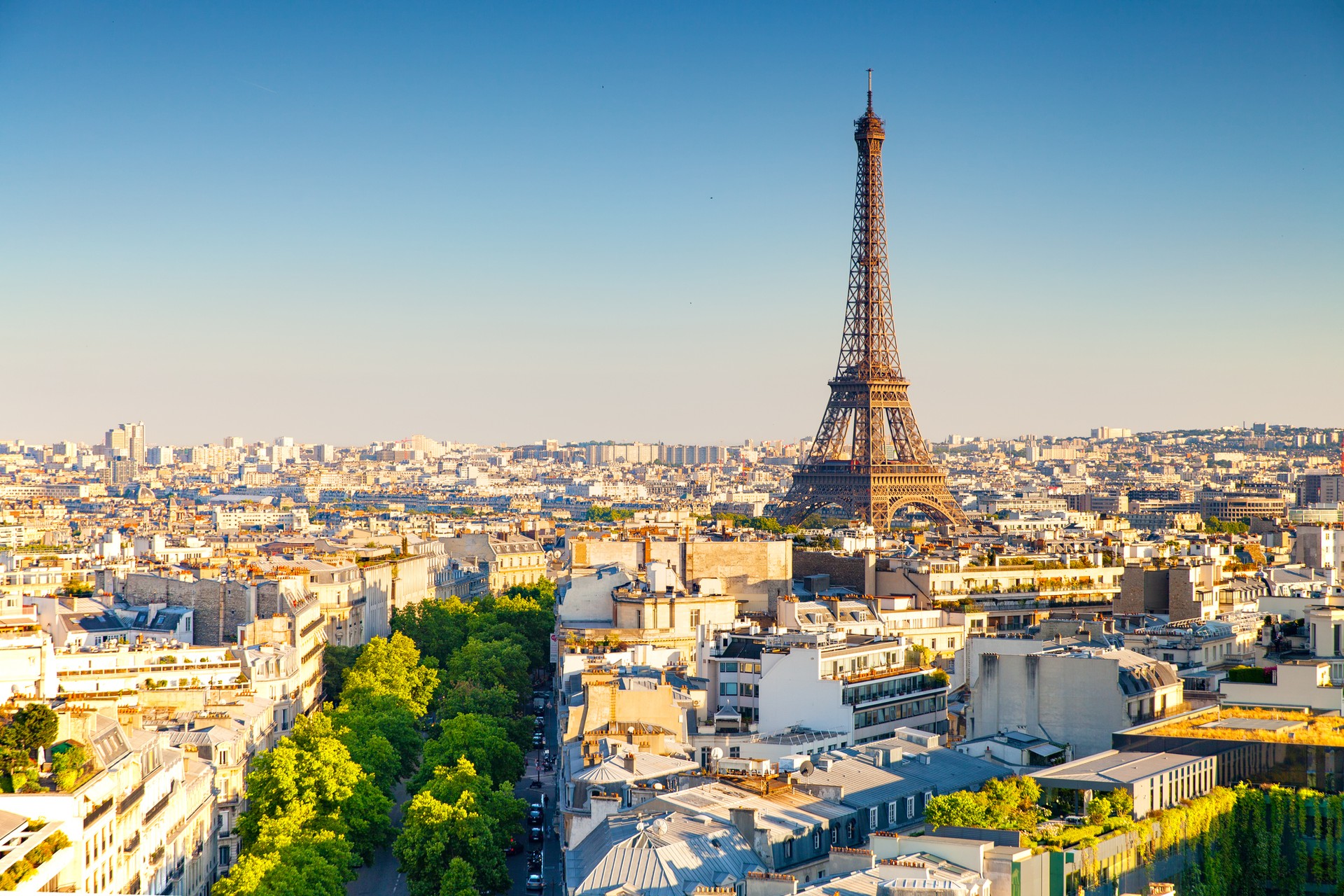 The Eiffel Tower in Paris, France, rises above the city and creates an iconic skyline view.