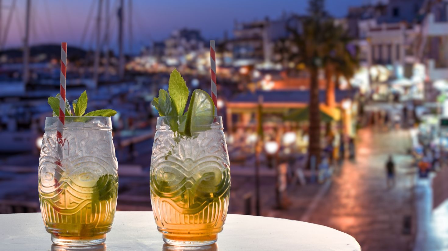 Two drinks overlooking the mediterranean harbor.