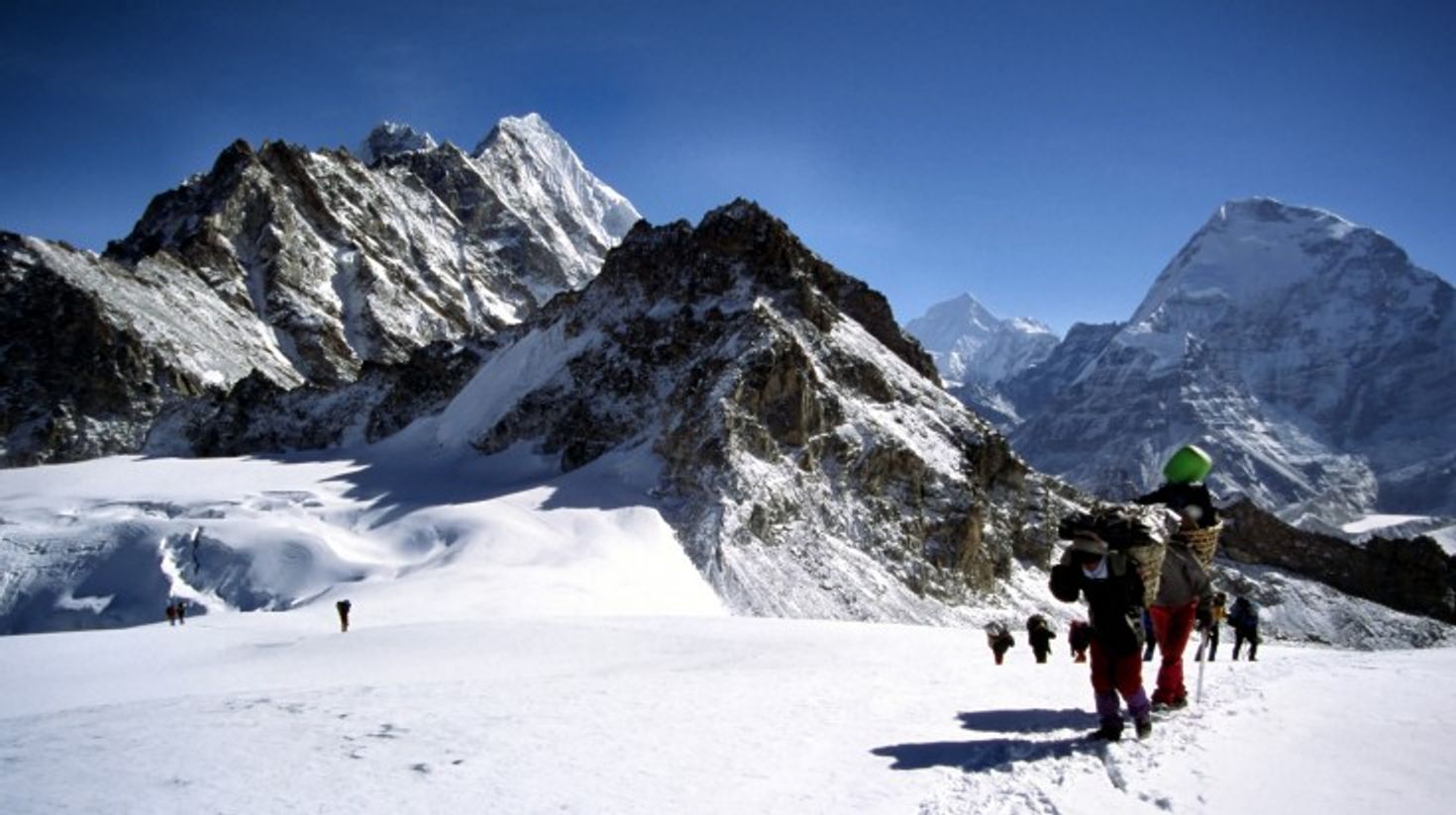 A group of trekkers and Sherpa's passing through the French Pass.