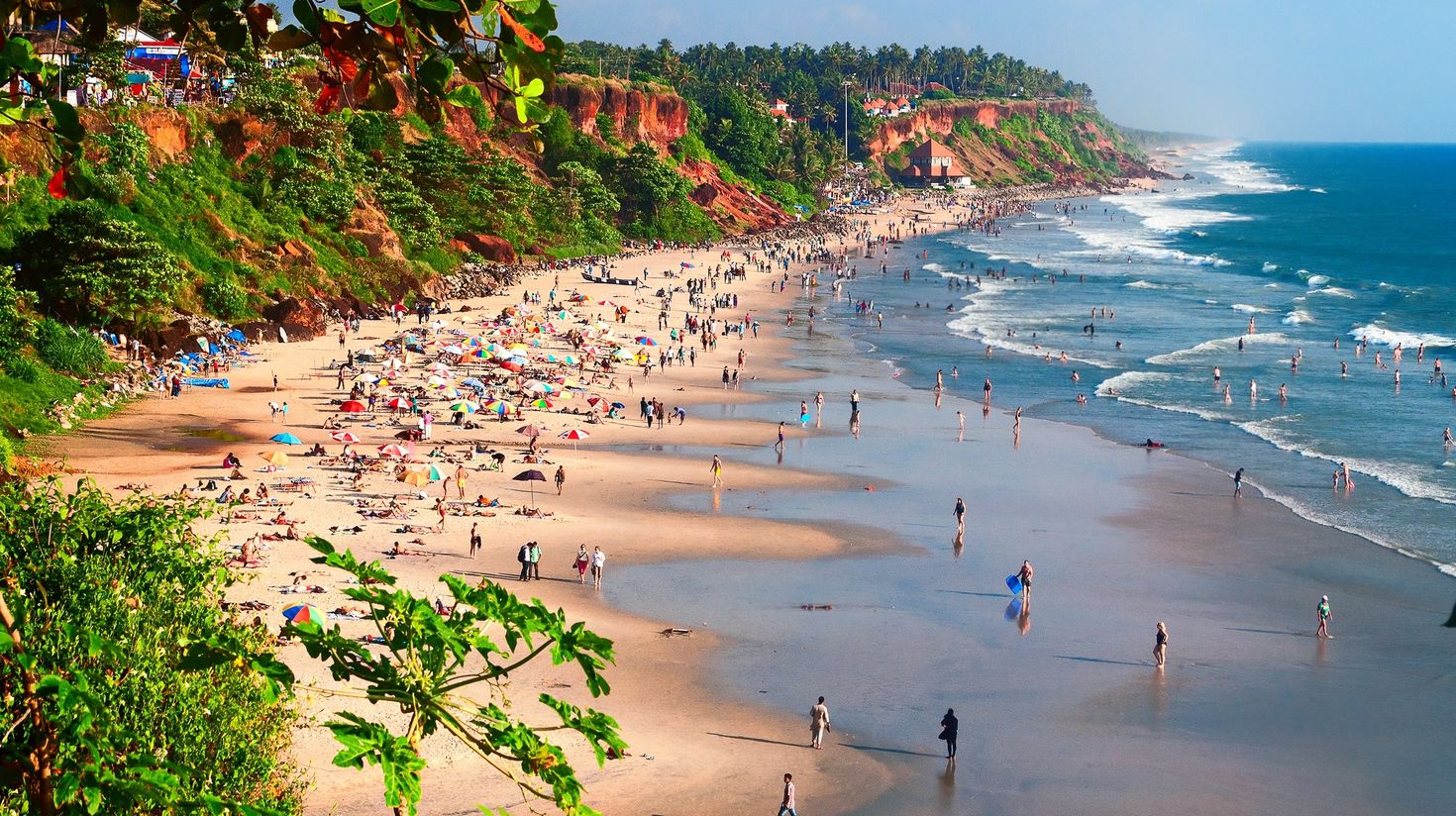 Travelers enjoying their time at Varkala beach in India