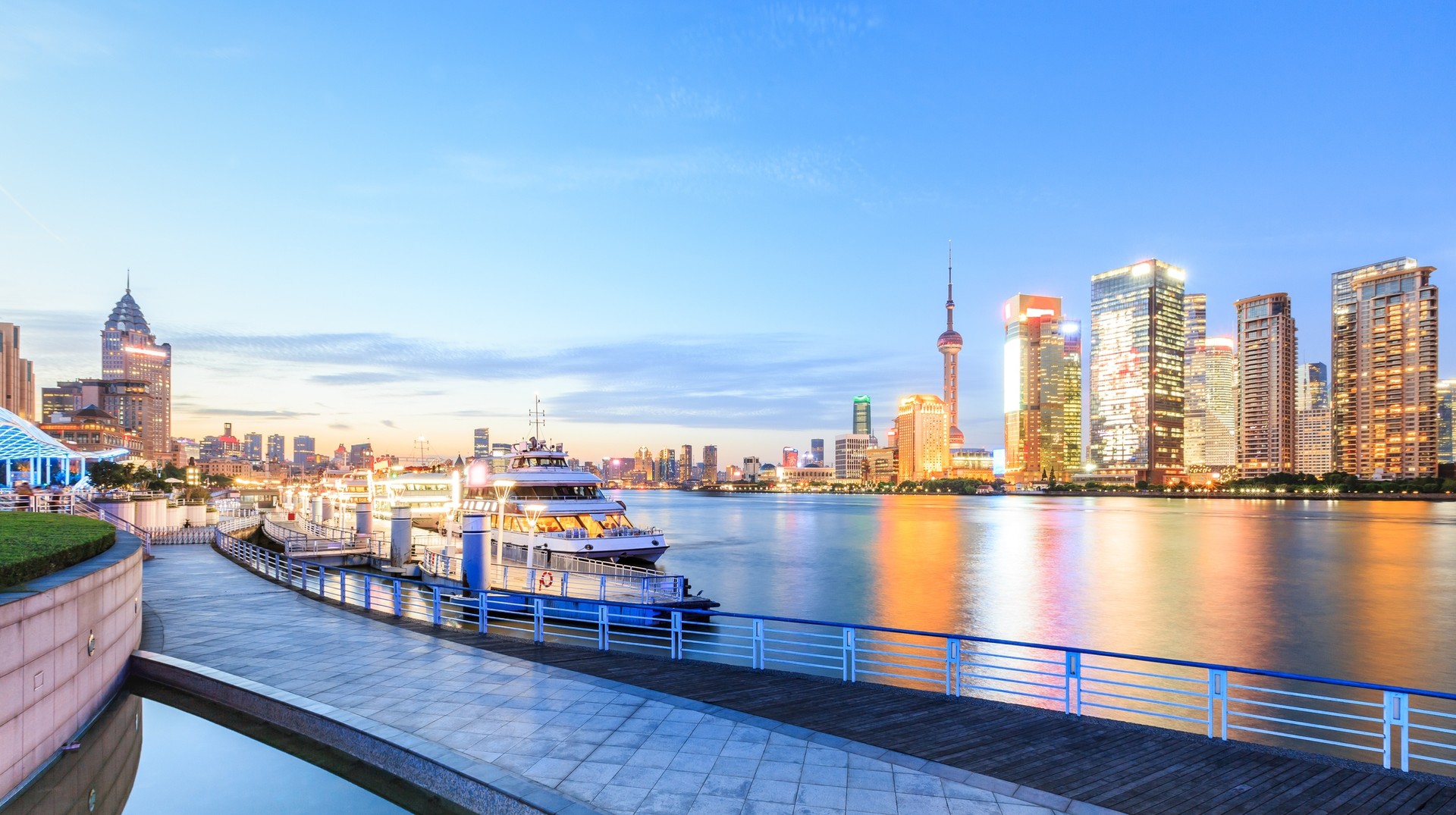 Huangpu River divides Shanghai into two sections, Pudong and Puxi A cruise boat on stand-by at the port in Shanghai