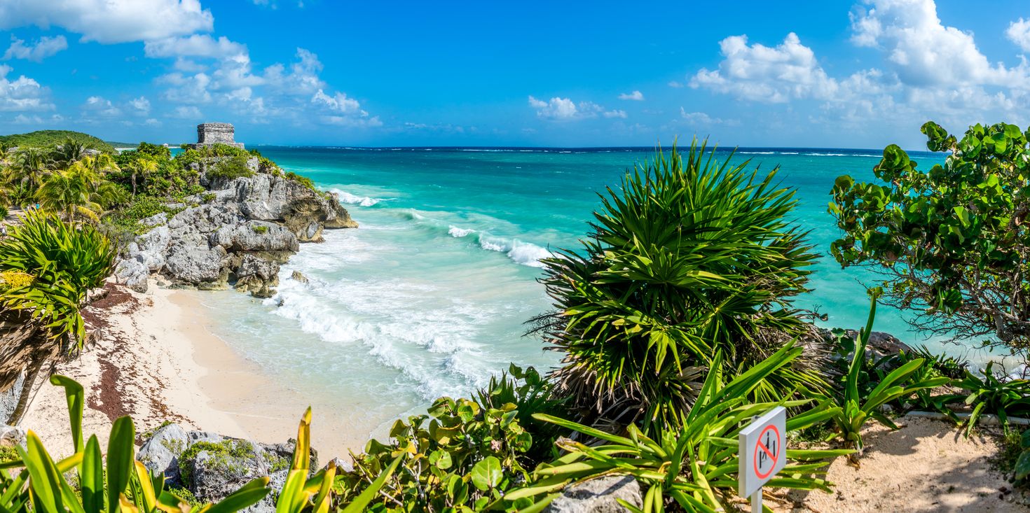 Panoramic view of Tulum beach in Mexico on a sunny day.