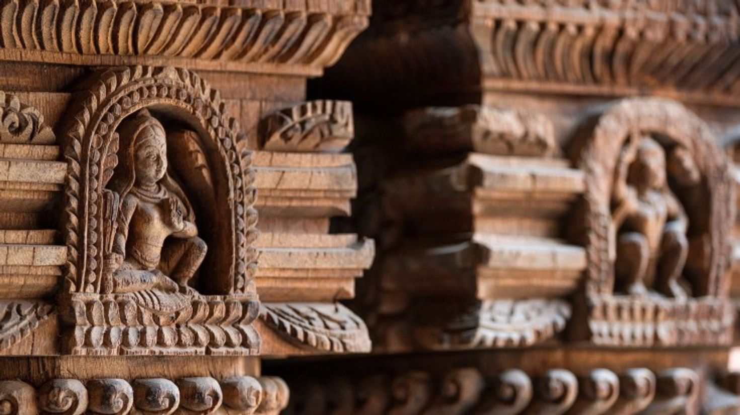 See carved wood wall decoration in Patan Durbar Square.