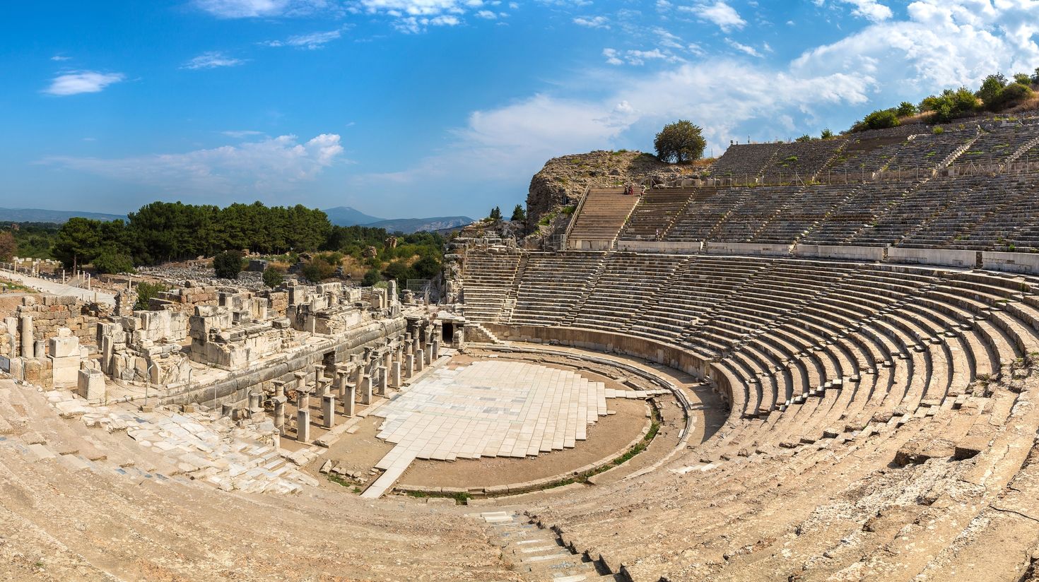 Visit the ancient amphitheater in Ephesus on a sunny day.