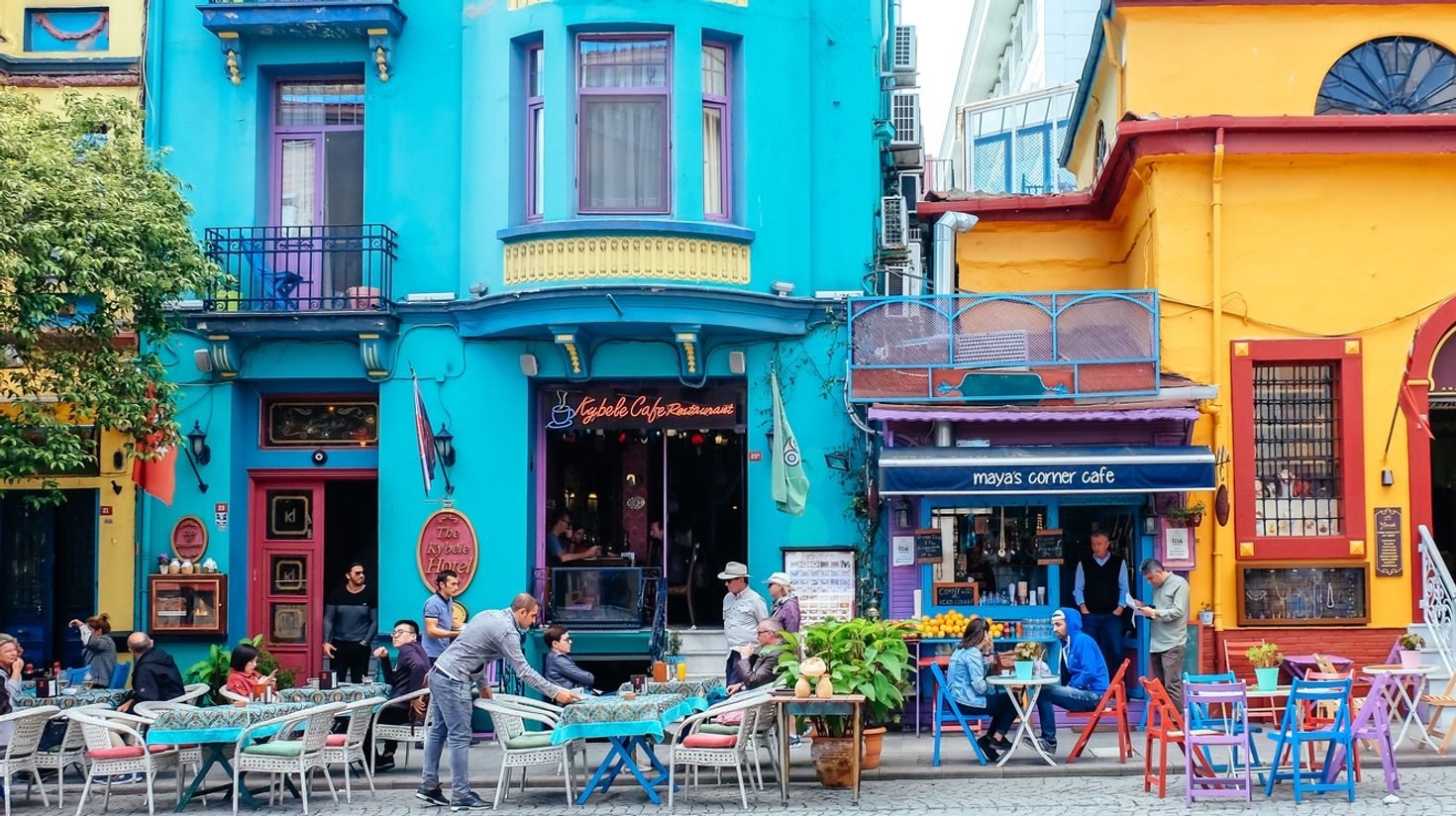 Tourists sitting outside cafes and restaurants in Istanbul.
