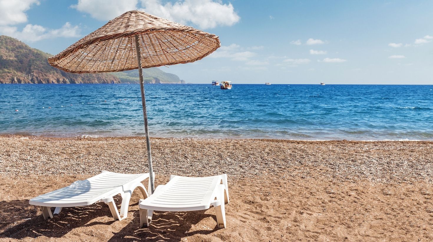 You can relax on these sunbeds on sandy beaches while touring Turkey.