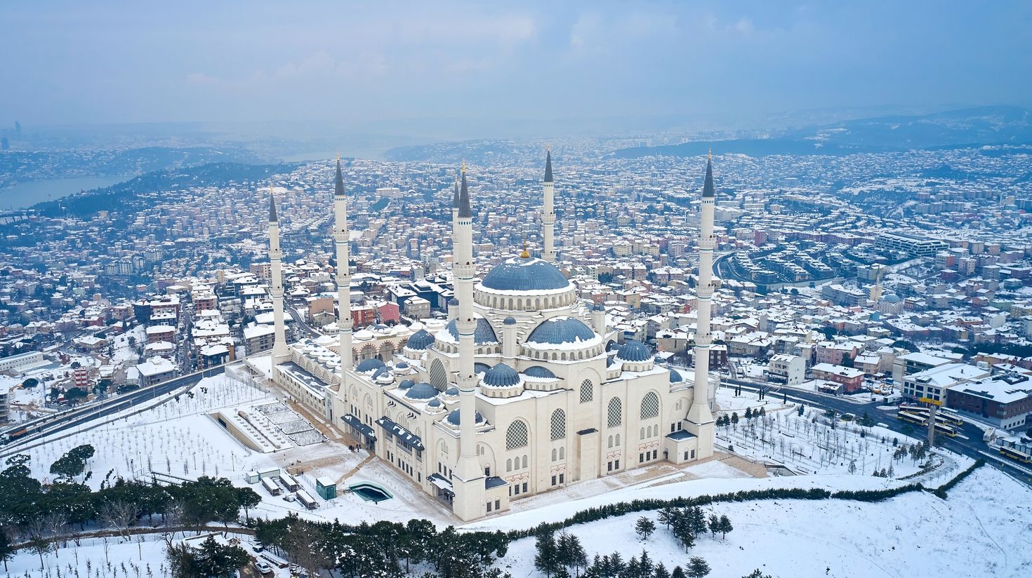 An aerial view of the Grand Mosque in Istanbul covered in snow.