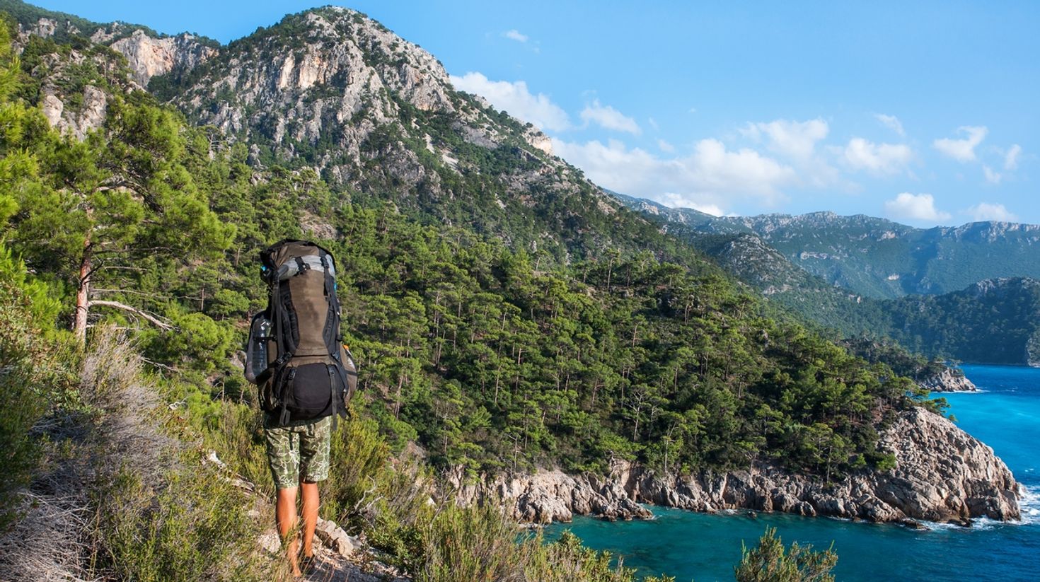 A backpacker hiking in the Lycian Way in Turkey.