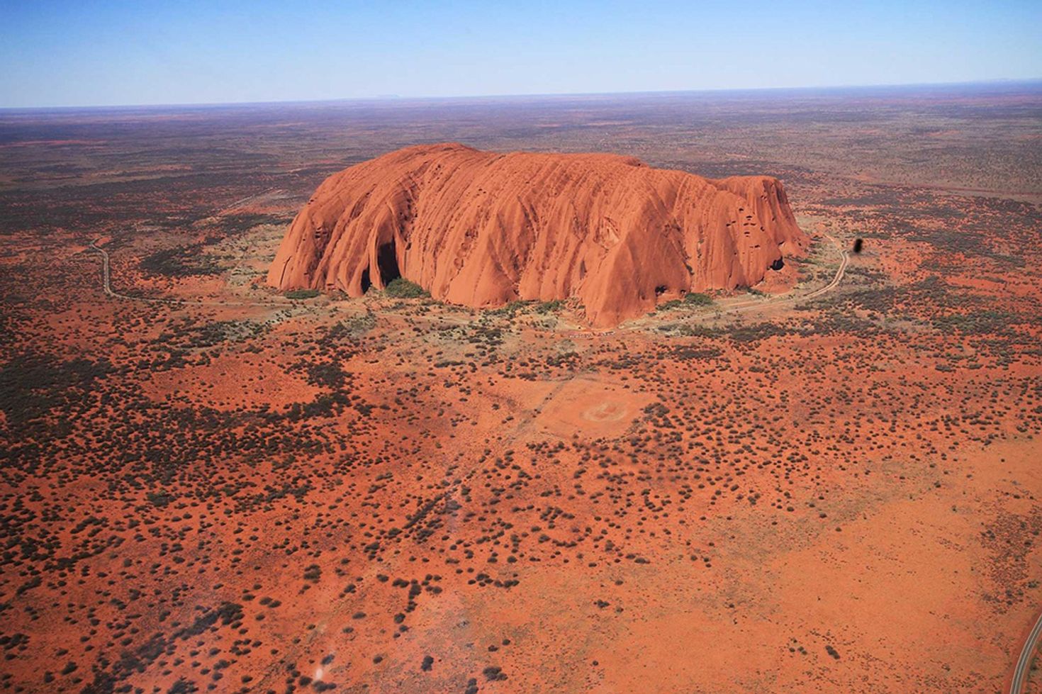 Aerial view of Uluru Rock that shows the size of the massive monolith.