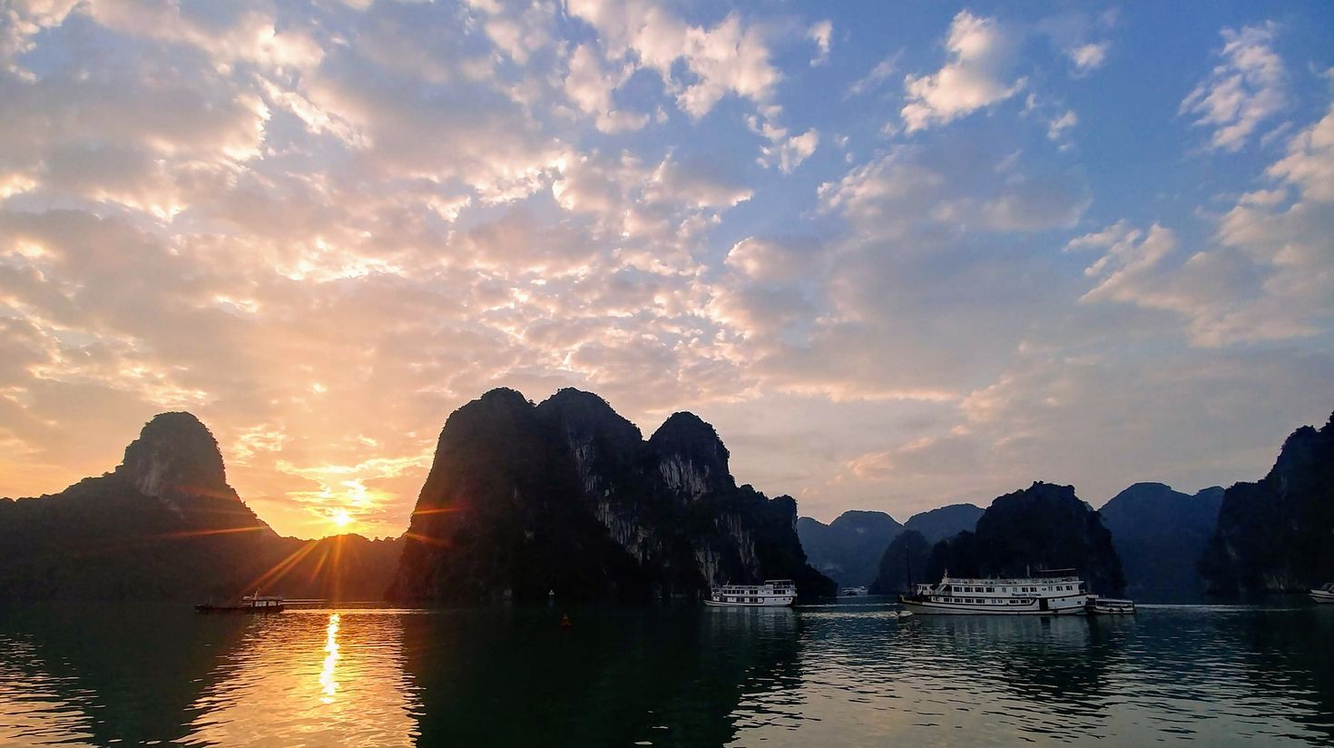 Hop on sunset cruises in Halong Bay while spending 2 weeks in Vietnam.