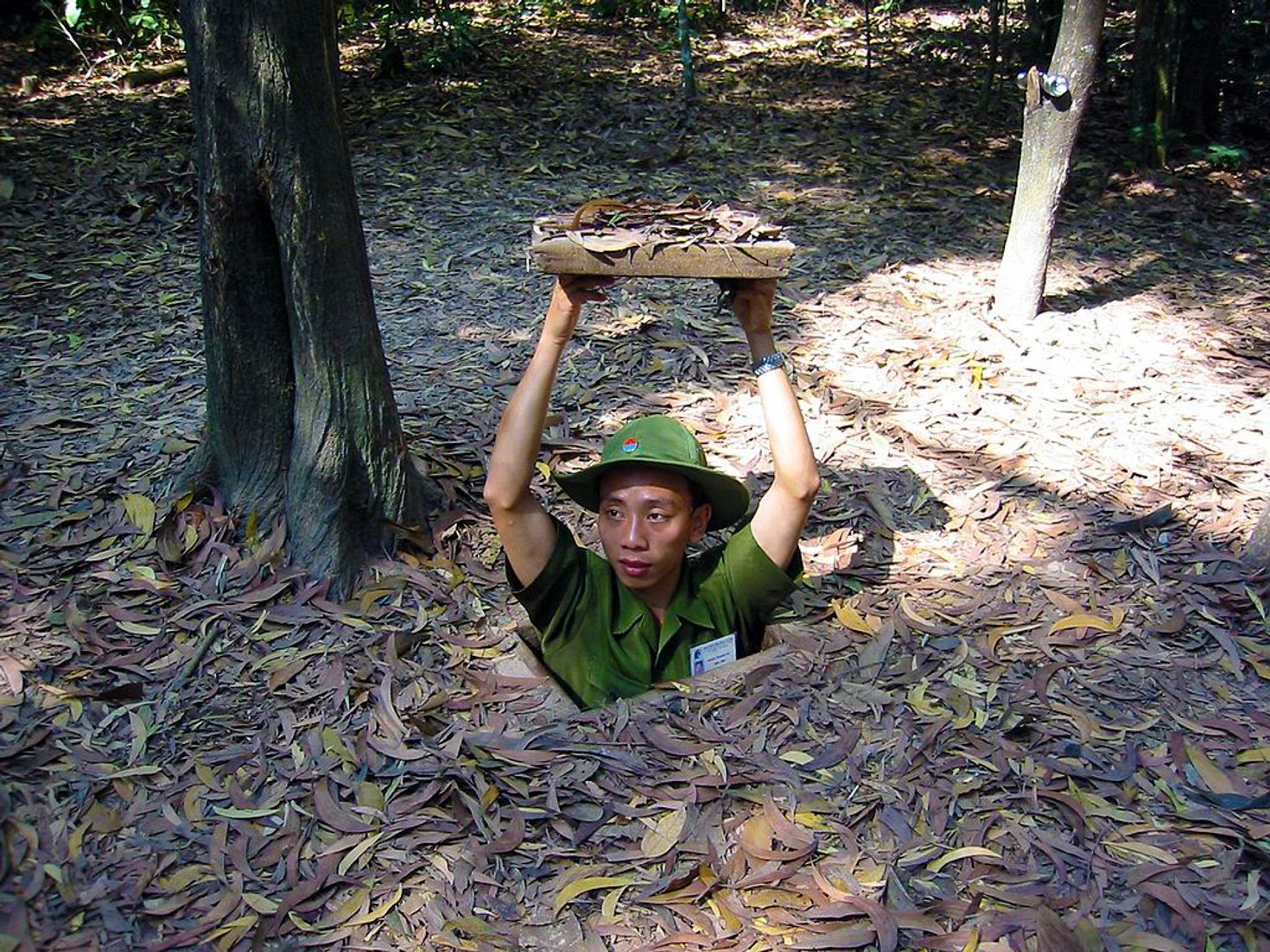 Guide in Ho Chi Minh city coming out of Cu Chi tunnels.