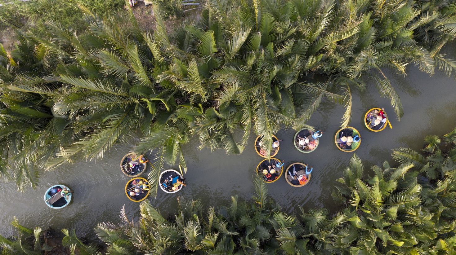 Aerial view of people sailing on basket boats in Cam Thanh village, Hoi An.