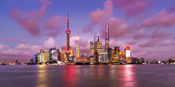 Panoramic, evening view of Pudong's skyline from The Bund