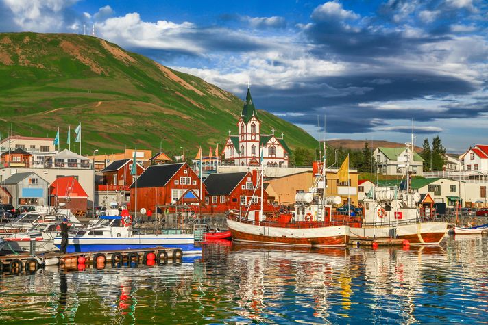 Boats lined up in Husavik for whale watching in Iceland