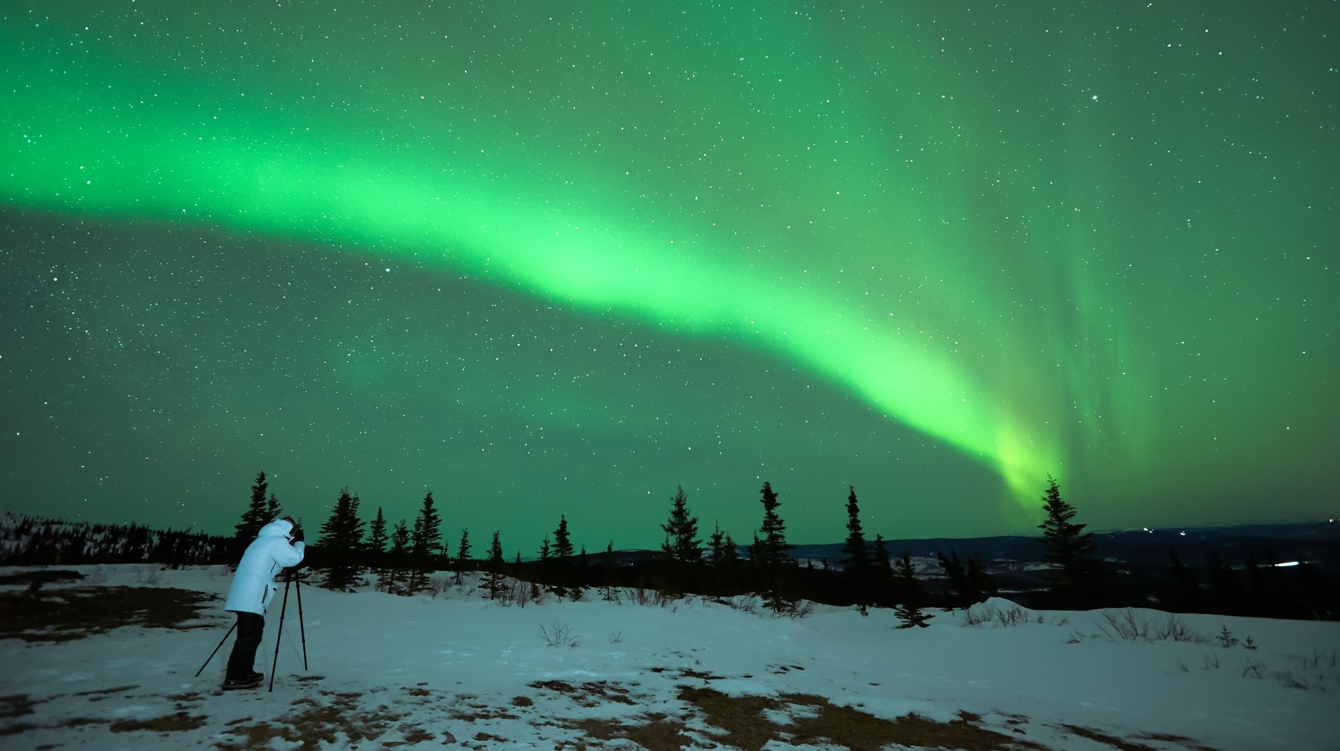 Man photographing Aurora Borealis in Iceland Aurora Borealis in Iceland