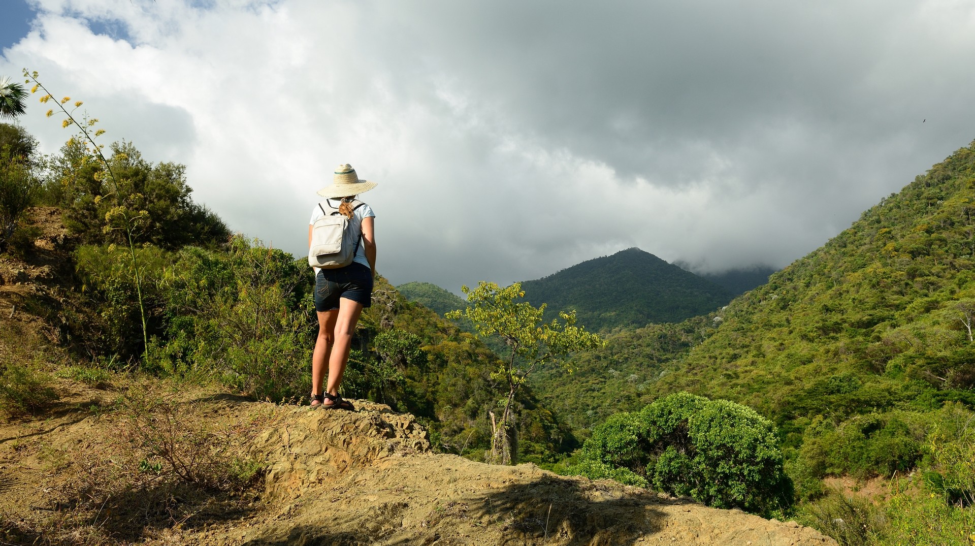 Woman looking at a mountain on her hike through the Sierra Maestra during winter in Cuba.