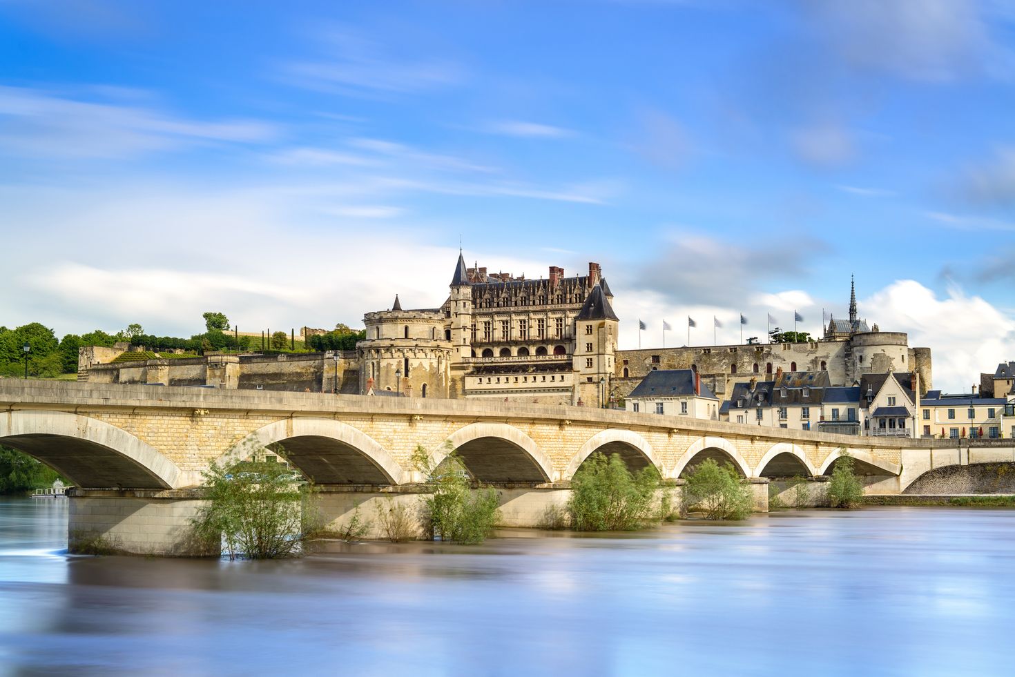 A medieval castle and bridge on Loire river in France
