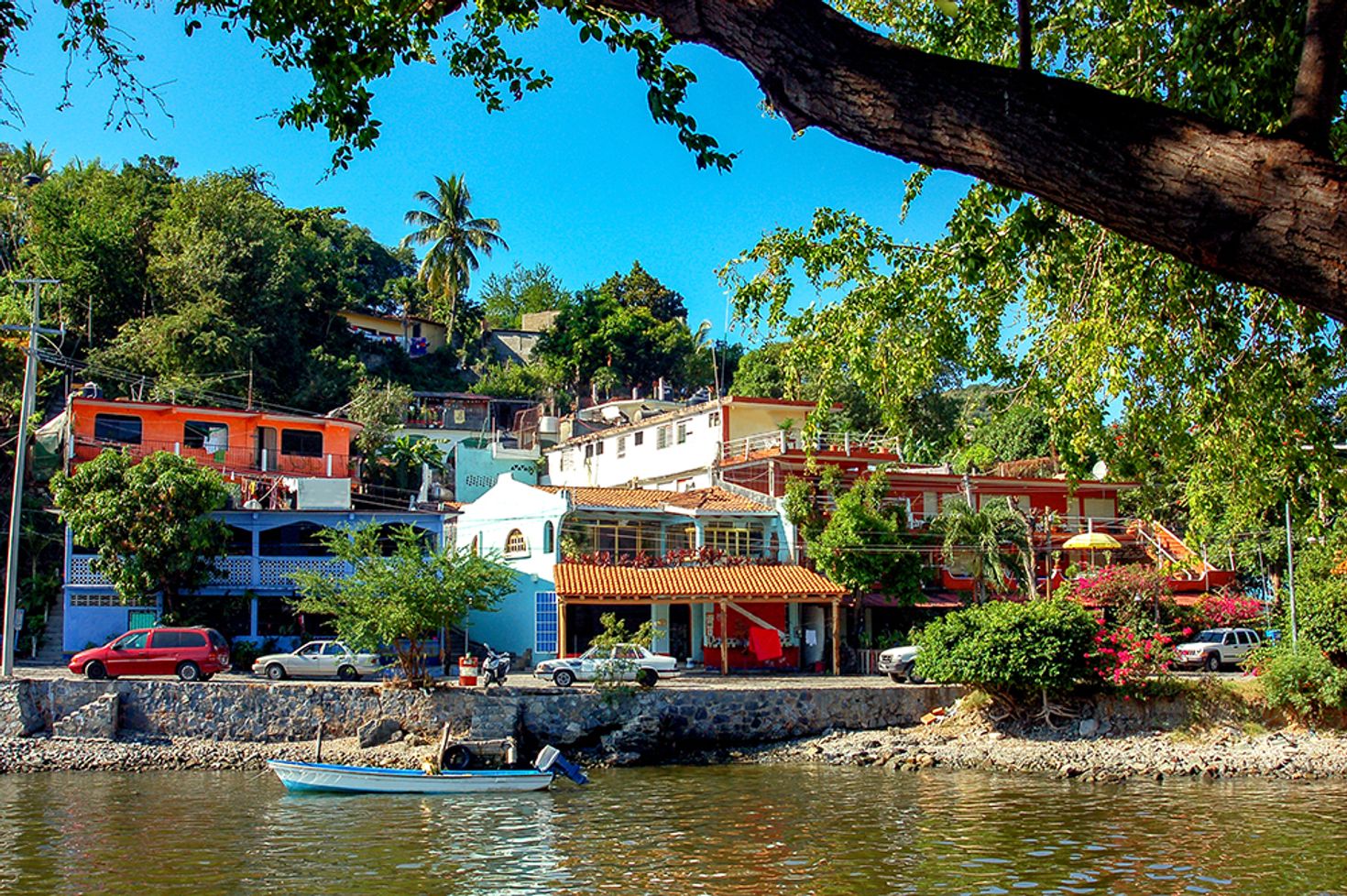 Colorful houses next to a pond in Zihuatanejo in Mexico