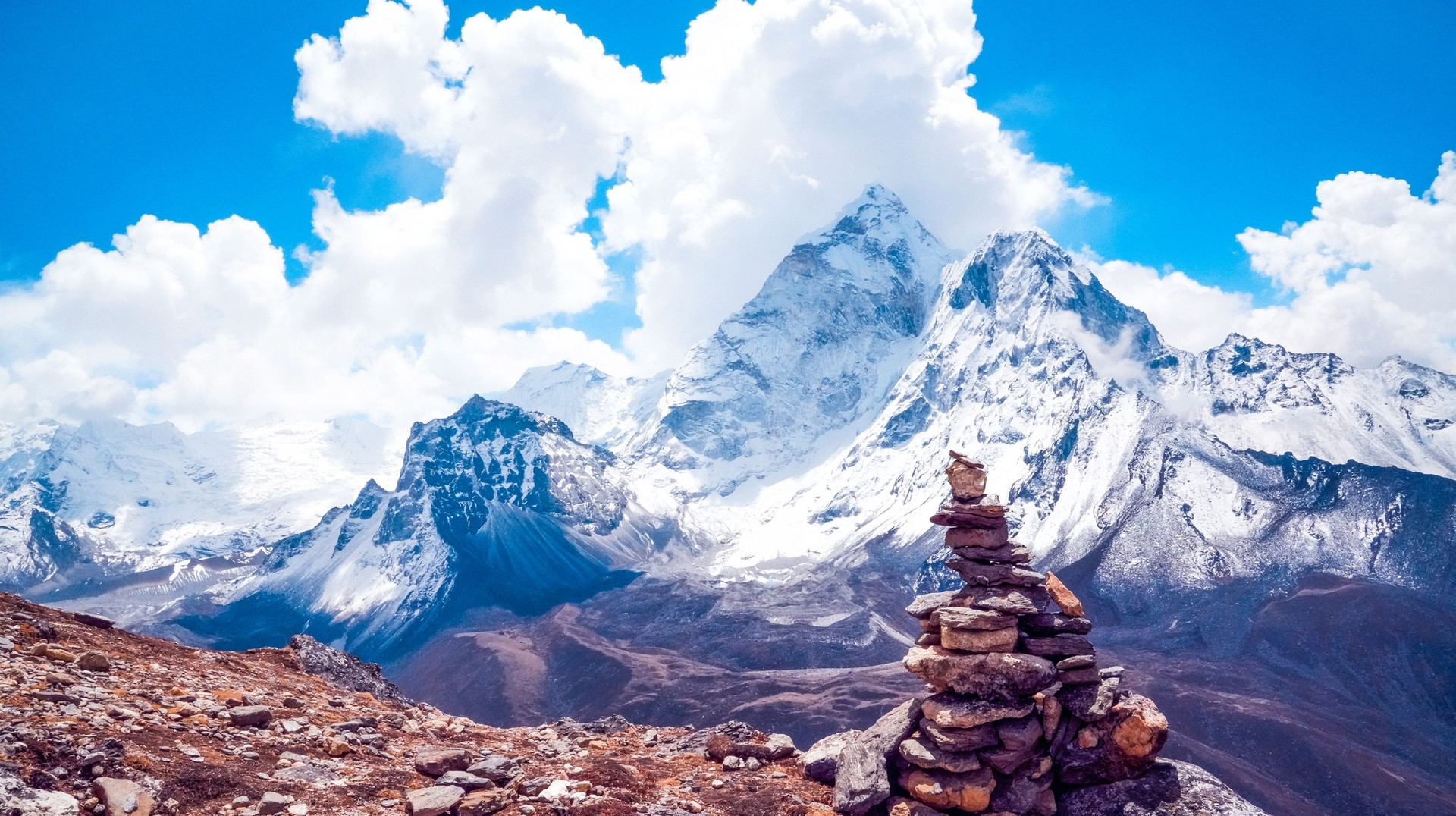 A pile of rocks with mountains in the background in winter in Nepal.