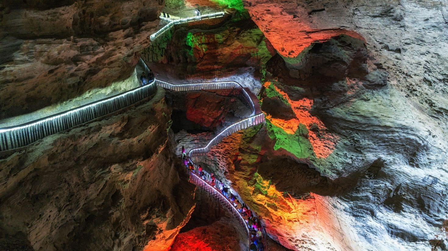 Yellow Dragon Cave, a fascinating limestone grotto in colourful lighting