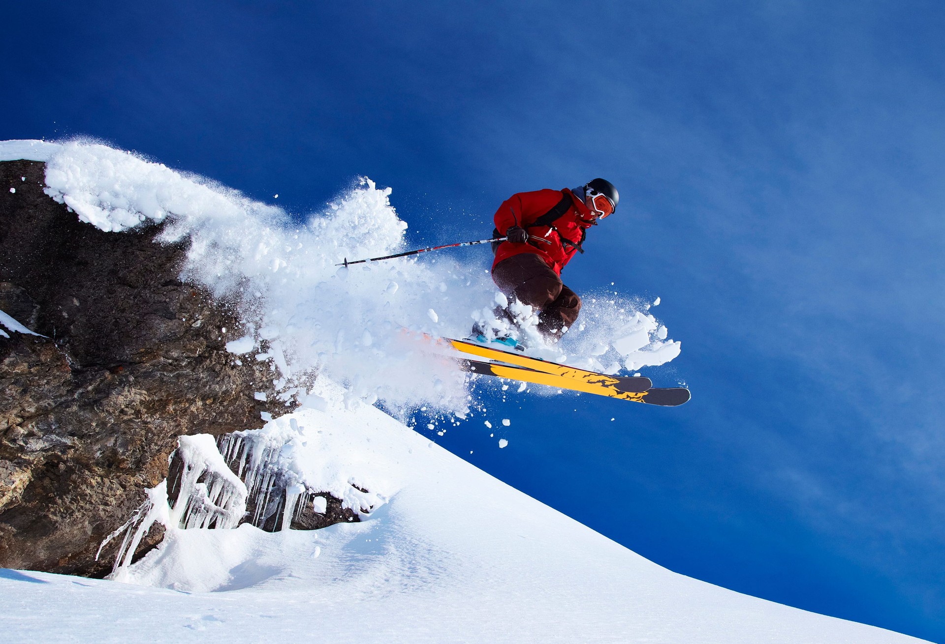 Skier jumping on snowy slope